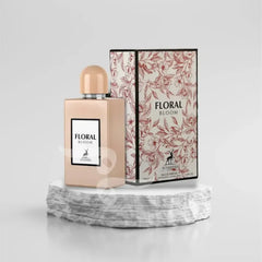 Roze gouden parfumfles en doos met Floral Bloom branding van Hambra EDP