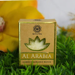 Amber geurbloek in een goudrandige doos met groene boom en tree amber aroma