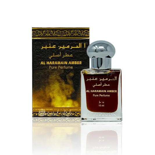 Een 15ml glazen fles al haramain parfumolie amber met zilveren dop en amberkleurige vloeistof binnenin