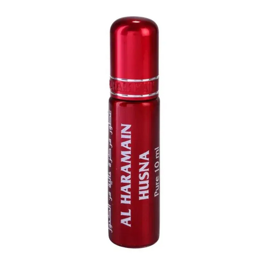 Een slanke rode metalen rollerball parfumfles met zilveren band en witte letters al haramain husna pure 10 ml