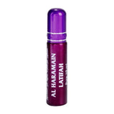 Een slanke metallic paarse roll-on parfumfles met een zilveren band en al haramain latifah label in wit