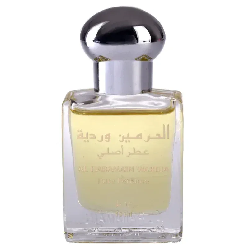 Een slanke transparante glazen fles met een gepolijst zilveren dop bevat de lichtgele Al Haramain parfumolie Wardia