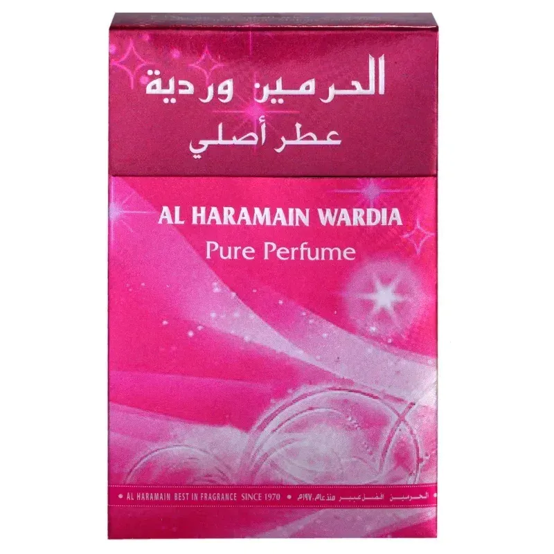 Een levendig roze rechthoekige doos van al haramain wardia pure parfumolie met witte arabische en Engelse tekst en fonkelende sterretjes