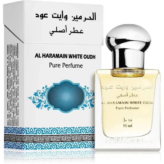 Een slanke transparante glazen fles al haramain parfumolie white oudh met zilveren dop en goudgeel vloeistof