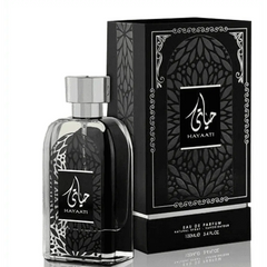 Zwarte hayaati lattafa eau de parfum fles met zilveren dop en witte kantpatronen naast zwarte verpakking