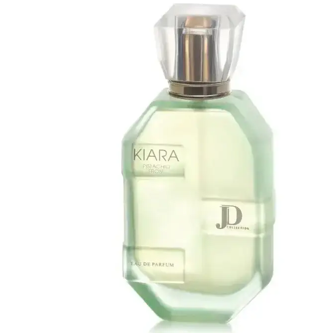Een elegant lichtgroen glazen parfumflesje kiara pistachio frost edp met een geslepen kristallen dop en goudkleurige accenten