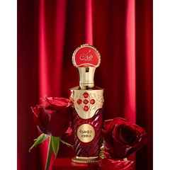 Een luxueuze rode en gouden johra edp 100 ml parfumfles met gebeeldhouwde patronen en robijnrode accenten