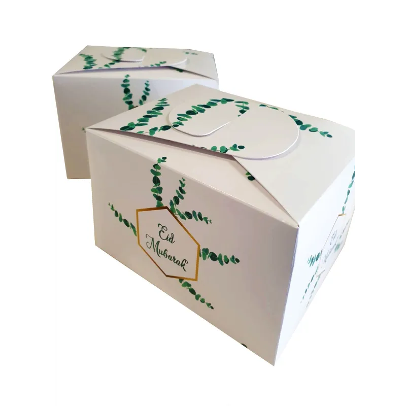Witte Eid Mubarak doos met groene eucalyptus blad en mooie voedselveilige dozen