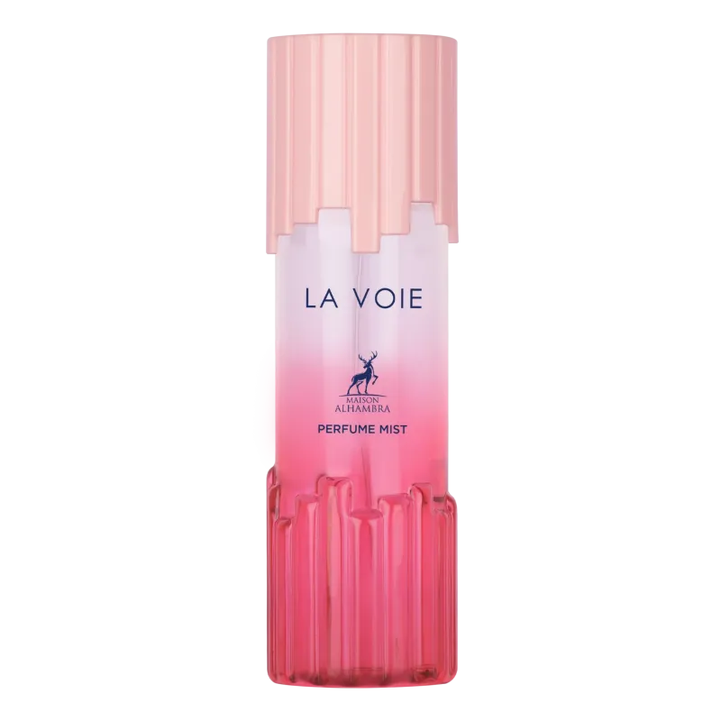 Een elegante roze gradient body mist fles met geribbeld glas en dop van maison alhamra genaamd la voie body mist