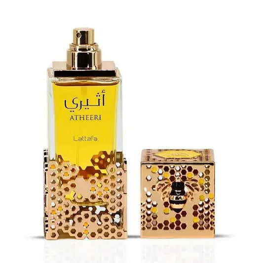 Lattafa atheeri gouden honingraat parfumfles met goudkleurige spray en bijpassende doos met reliëf bijdesign