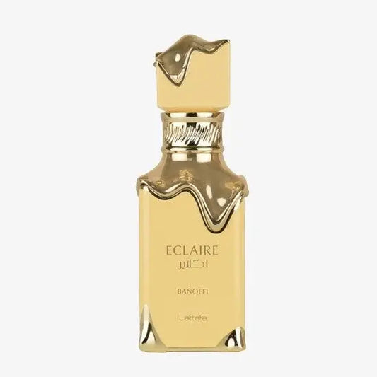 Lattafa eclaire banoffi edp gouden vierkante parfumfles met druipende gouden dop en basis labeled eclaire