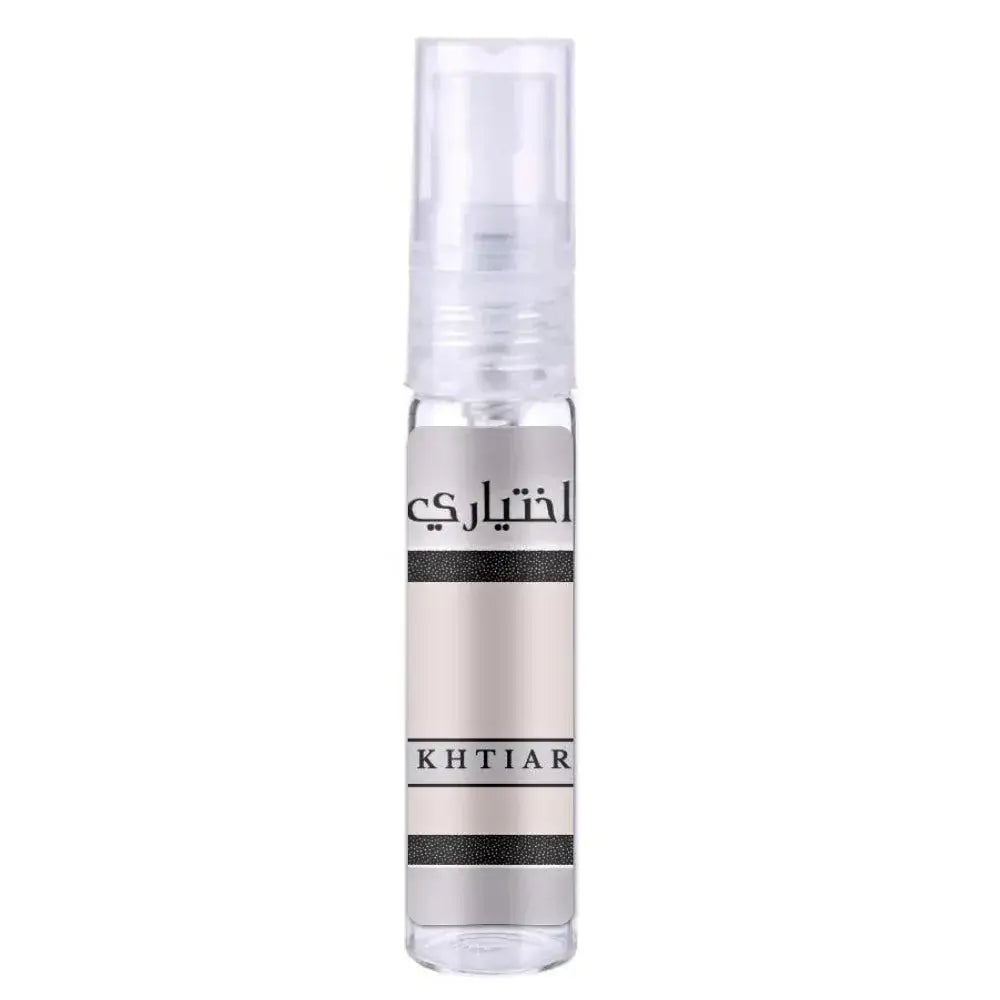 A sleek transparent spray bottle with a silver metallic label and black text reading khtiar for lattafa parfum ekhtiari