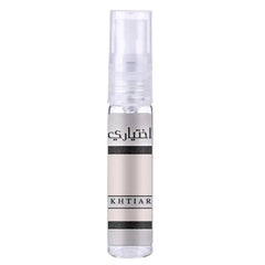 A sleek transparent spray bottle with a silver metallic label and black text reading khtiar for lattafa parfum ekhtiari