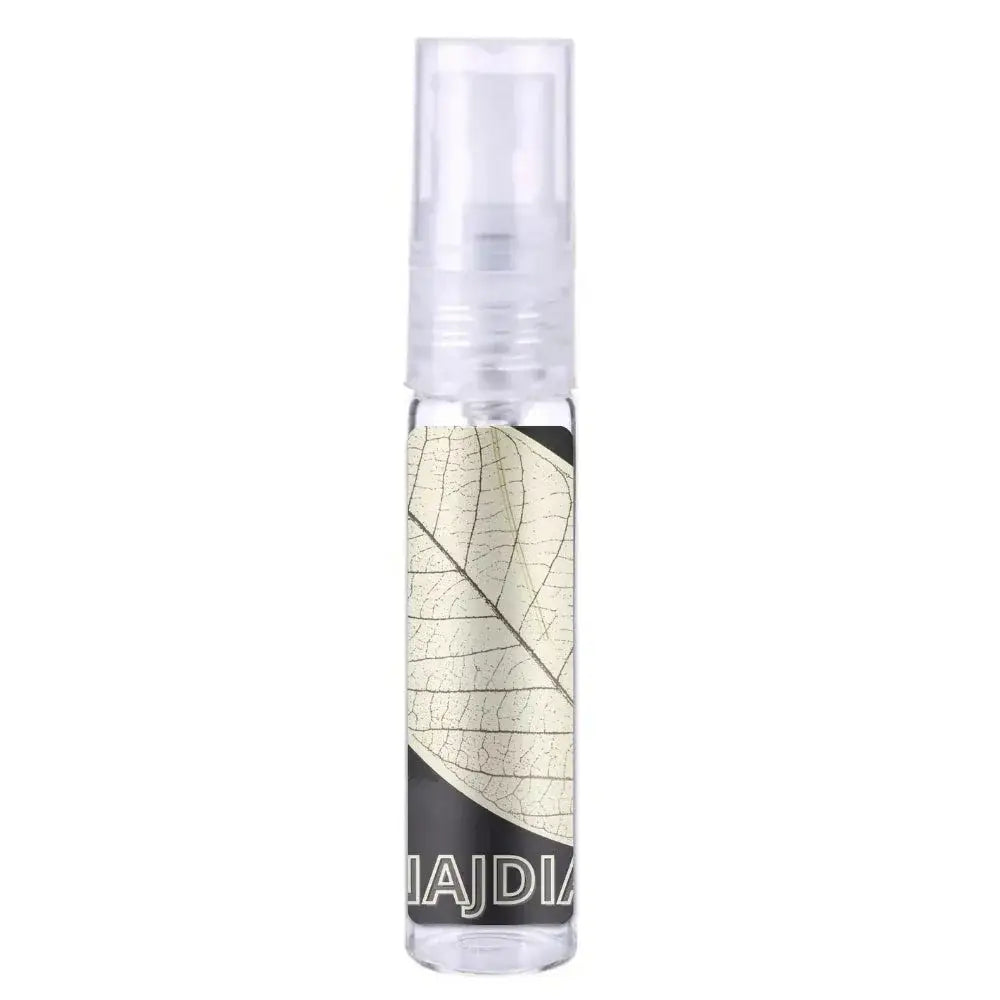 Heldere glazen sprayfles met transparante dop en beige bladontwerp op etiket voor Lattafa Parfum Najdia