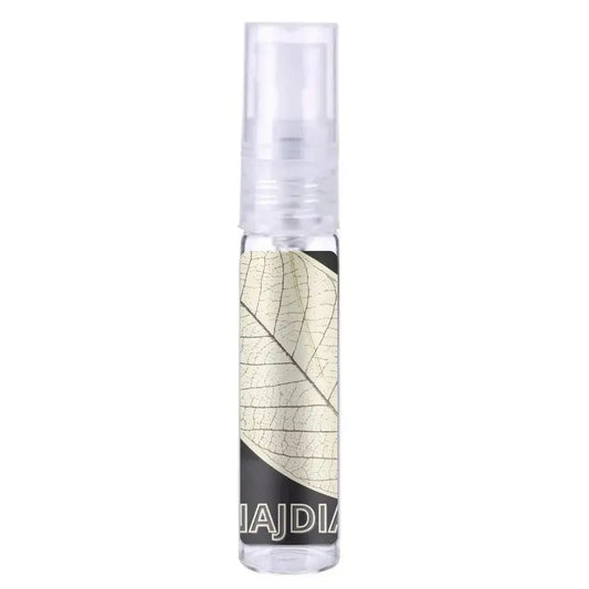 Heldere glazen sprayfles met transparante dop en beige bladontwerp op etiket voor Lattafa Parfum Najdia