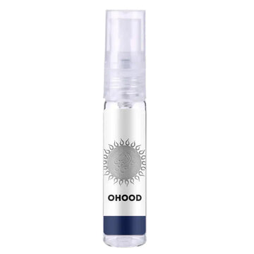 Heldere glazen sprayfles lattafa parfum ohood met zilveren zonembleem en wit label met navy blauwe band