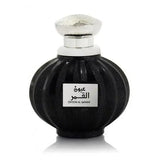 Zwarte ribbelige glazen parfumfles met zilveren dop en label oyoon al qamar van lattafa parfum