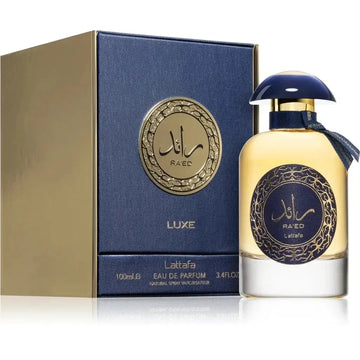 Lattafa parfum raed gold luxe luxe parfumfles in marineblauw met gouden accenten en een glanzende donkerblauwe dop gevuld met gouden vloeistof
