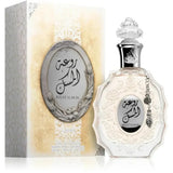 Lattafa parfum rouat al musk heldere glazen parfumfles met zilveren bloemenpatroon en facetris kristalstopper naast matching doos