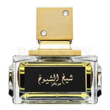 Een luxueuze transparante glazen parfumfles met gouden accenten en een sierlijke gouden dop met kristallen van Lattafa Parfum Sheikh al Shuyukh Concentrated