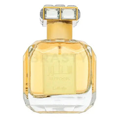 Een luxueuze goudkleurige glazen parfumfles van lattafa parfum sutoor met een facetten geometrisch ontwerp en kristallen dop