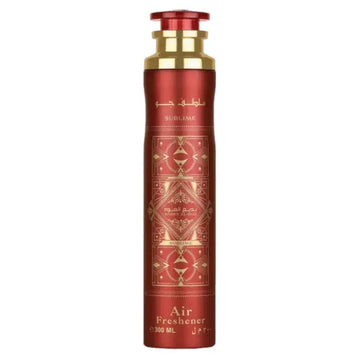 Rood cilindrische luchtverfrisser met gouden accenten en geometrisch patroon labeled sublime door mouloud voor bade e al oud gebruik