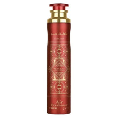Rood cilindrische luchtverfrisser met gouden accenten en geometrisch patroon labeled sublime door mouloud voor bade e al oud gebruik
