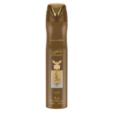 Brown aerosol luchtverfrisser met gouden accenten en gouden adelaar embleem van lattafa shaheen gold