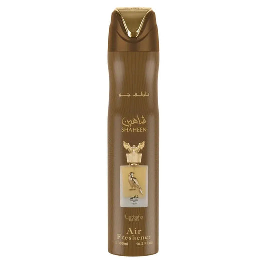 Brown aerosol luchtverfrisser met gouden accenten en gouden adelaar embleem van lattafa shaheen gold
