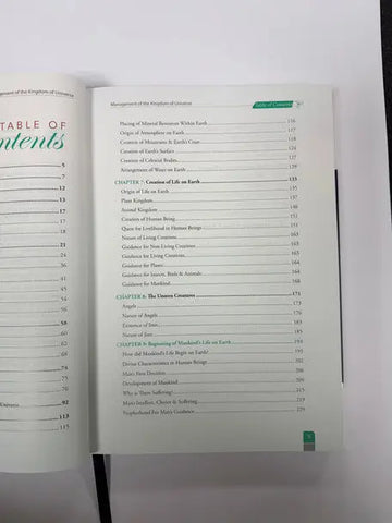 Open book with white cover and black text showing table of contents for management of the kingdoms of universe in quranic perspective