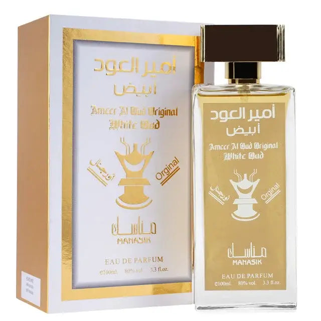 Een slanke transparante glazen fles amberkleurige amour al boud original white bud eau de parfum met goudkleurige dop en arabische letters van mahasik