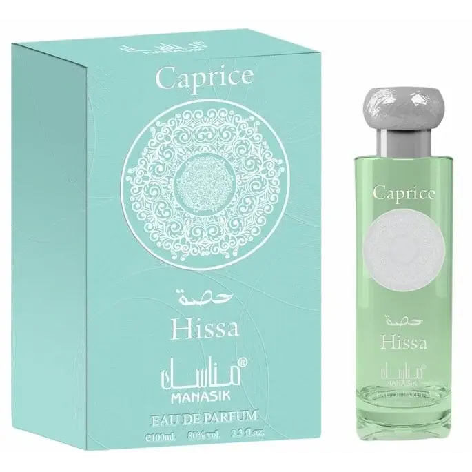 Manasik hissa caprice eau de parfum in een helder glazen fles met zilveren dop en lichtgroene vloeistof naast mintgroene doos met wit ontwerp