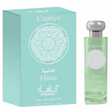 Manasik hissa caprice eau de parfum in een helder glazen fles met zilveren dop en lichtgroene vloeistof naast mintgroene doos met wit ontwerp