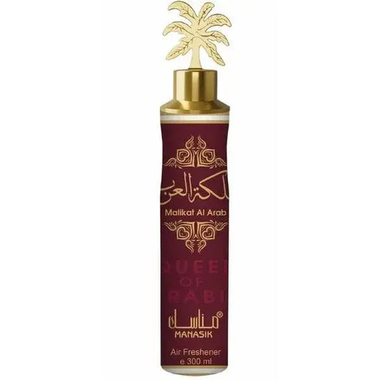 Een maroon glazen fles met gouden dop en palmboomstift labeled malikat al arab door mahasik voor manasik luchtverfrisser