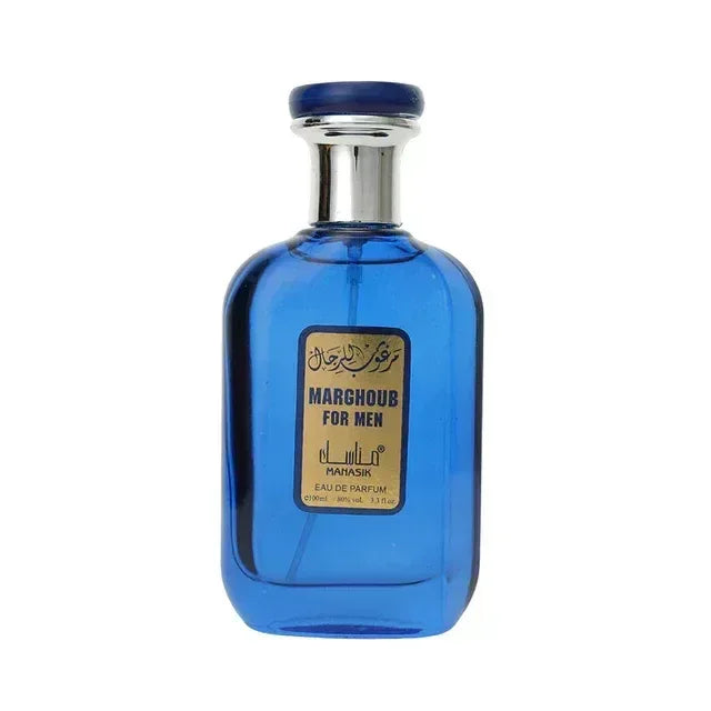 Een levendige blauwe glazen fles manasik marghoub voor heren eau de parfum met zilveren dop en gouden etiket