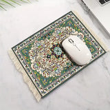 Muismat met perzisch tapijtdesign in groen en crème met franjeranden en intrigerende bloemen- en geometrische patronen