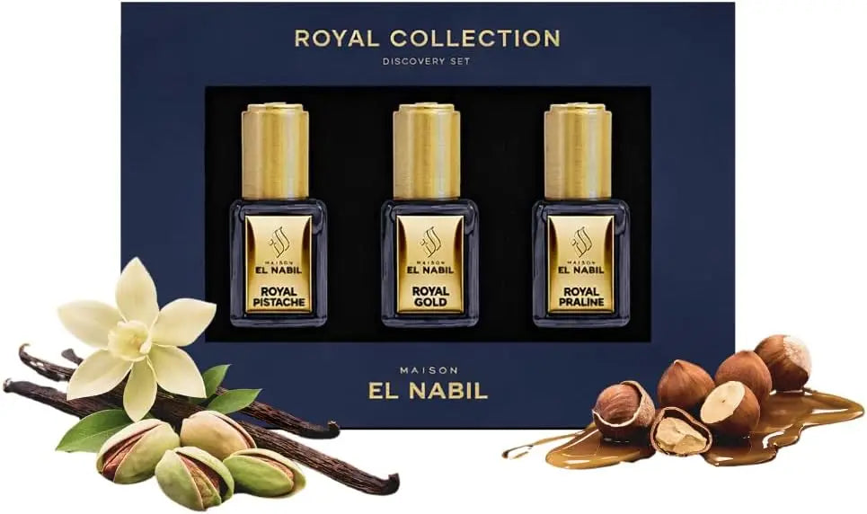 Drie elegante goudkleurige parfumflesjes in een marineblauwe doos van maison el nabil royal collection discovery set musc collection giftset
