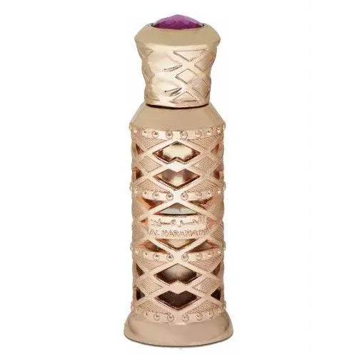 Goudkleurige parfumfles musk al haramain parfumolie met ingewikkeld rasterontwerp en paarse edelsteen dop