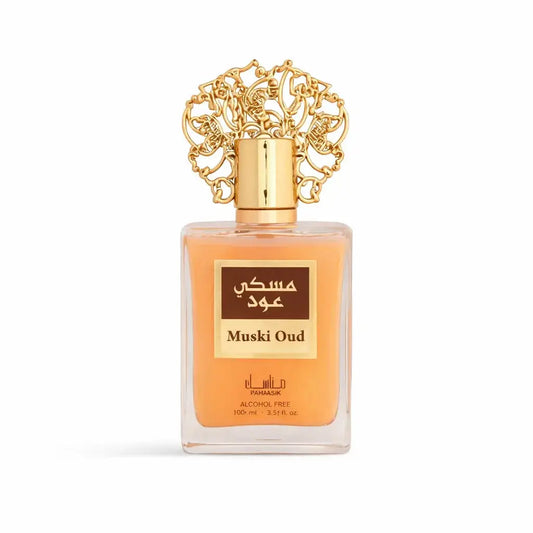 A rechthoekige glazen fles muski oud alcoholvrije parfum van pamaasik met een gouden decoratieve dop en amberkleurige vloeistof