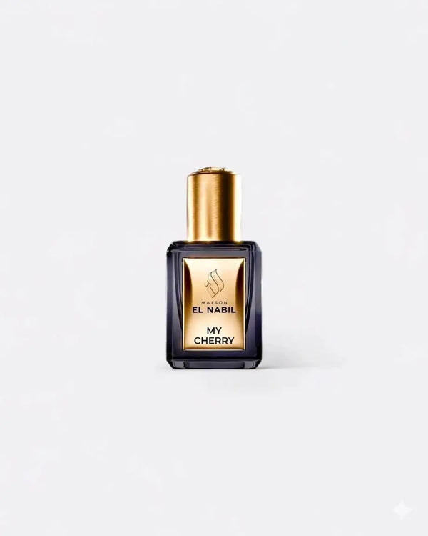 Donkere glazen parfumfles met gouden dop en etiket van maïson el nabil my cherry parfumolie