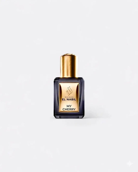 Donkere glazen parfumfles met gouden dop en etiket van maïson el nabil my cherry parfumolie