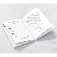 Witte doeljournal met zwarte bloemillustraties en My Deen Planner Beige