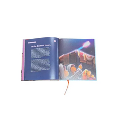 Open childrens book my first salah book showing illustrated characters looking at bright light with orange bookmark
