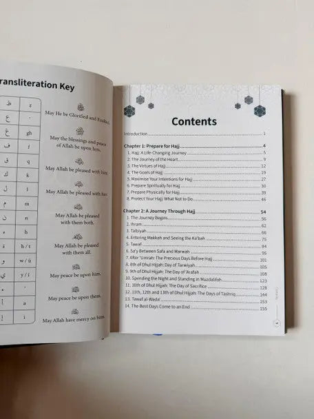 Open book my hajj companion with transliteration key and contents page in arabic and english for hajj guidance