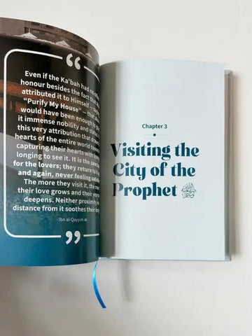 Open book from my umrah companion with teal text and chapter titled visiting the city of the prophet on white pages