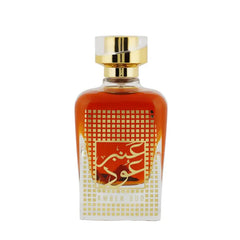 Amberkleurige parfumfles met gouden accenten voor Nusuk Parfum Amber Oud