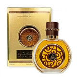 Goudenkleurige parfumfles oud al sahraa edp met ingewikkeld bruin en goud ornament en donkere houten dop met metalen ketting