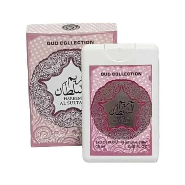 Witte plastic travel size parfum spray met roze en zilveren label uit de oud collectie van hareem al sulta