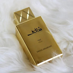 Goldkleurige parfum spray fles met getextureerde dop voor Shaghaf Oud Swiss Arabian