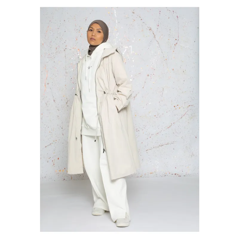 Crèmekleurige oversized parka jas met capuchon en trekkoord taille